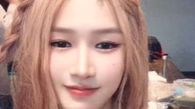 张伟丽粉色长发造型惊艳亮相，格斗女王展现全新娇俏面貌